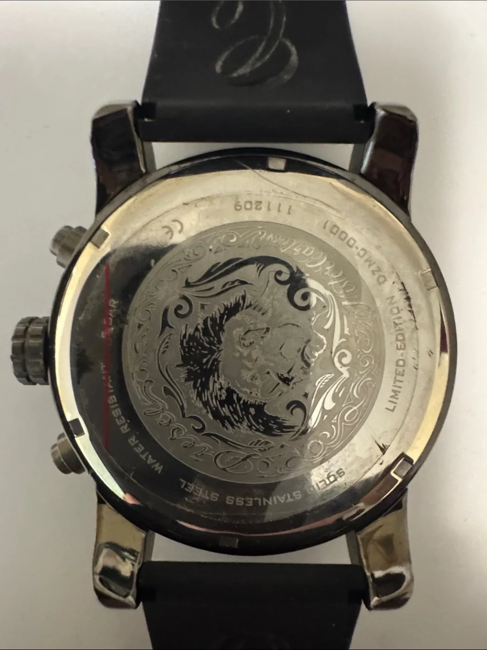 Mister Cartoon. Diesel Men's Black Watch with Subtle Red Dial Accents